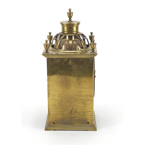 2137 - Brass lantern mantle clock engraved with boats, 22.5cm high