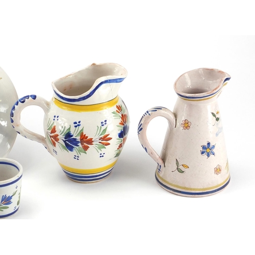 471 - Group of hand painted traditional French Quimper pottery including two jugs, plates, jam pot and cov... 