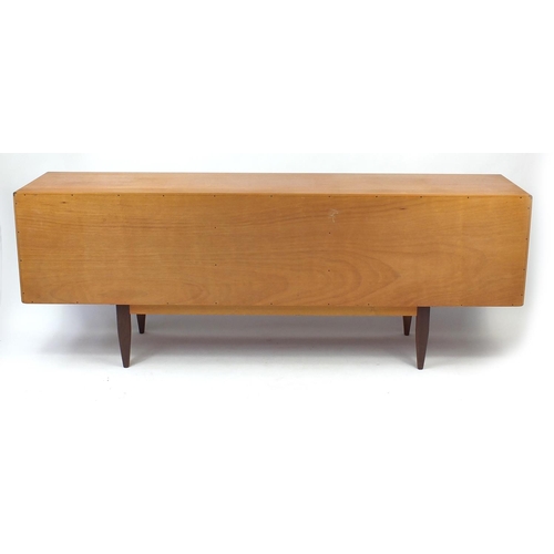 2026 - 1970's G-plan teak sideboard fitted four drawers flanked by two pairs of cupboard doors, label to th... 