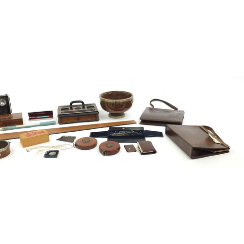 203 - Box of items including wooden desk stand, simulated pearl necklaces, vintage leather tape measures, ... 