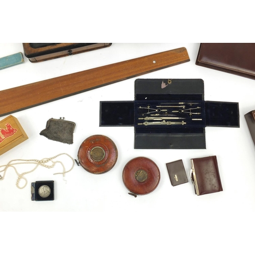 203 - Box of items including wooden desk stand, simulated pearl necklaces, vintage leather tape measures, ... 