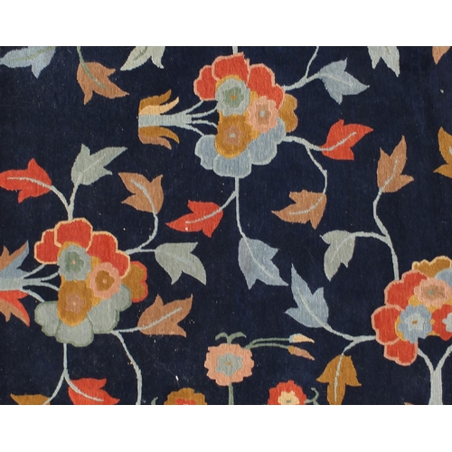 2021 - Rectangular Tibetan wool rug having all over floral motifs onto a blue ground, 202cm x 155cm