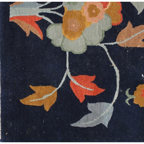 2021 - Rectangular Tibetan wool rug having all over floral motifs onto a blue ground, 202cm x 155cm