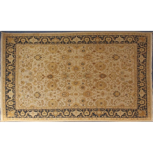 2010A - Rectangular Tabriz design carpet onto a beige ground, 350cm x 260cm