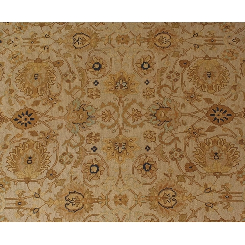 2010A - Rectangular Tabriz design carpet onto a beige ground, 350cm x 260cm