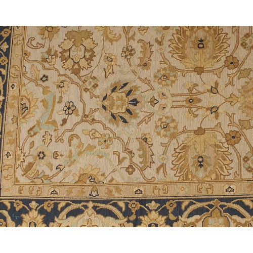 2010A - Rectangular Tabriz design carpet onto a beige ground, 350cm x 260cm