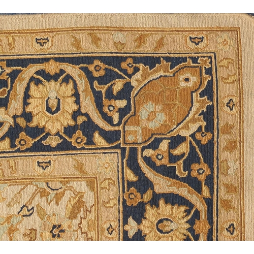 2010A - Rectangular Tabriz design carpet onto a beige ground, 350cm x 260cm