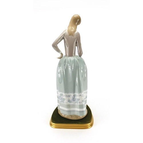 137 - Large Lladro figurine wearing a dress, 42cm high