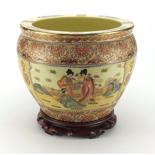 165 - Oriental porcelain jardinière raised on hardwood stand, 29cm high x 32cm in diameter