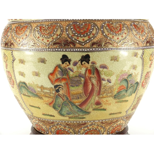 165 - Oriental porcelain jardinière raised on hardwood stand, 29cm high x 32cm in diameter