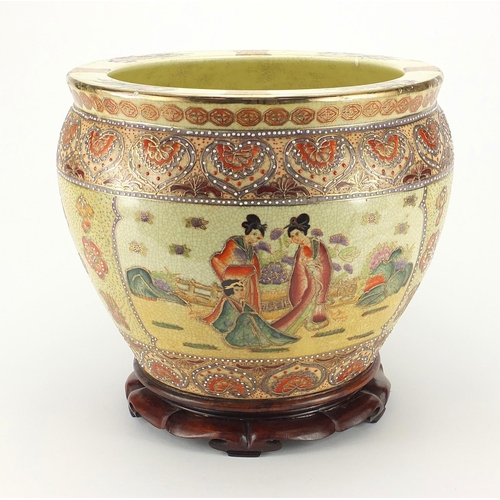 165 - Oriental porcelain jardinière raised on hardwood stand, 29cm high x 32cm in diameter