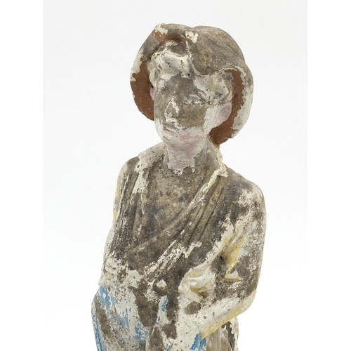 110 - Stoneware garden figure of a boy wearing a hat, 62cm high