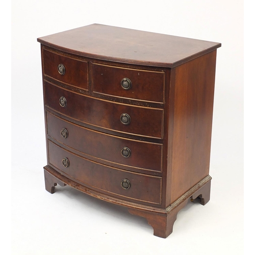 21 - Walnut quarter veneered bow front five drawer chest with bracket feet, 75cm H x 70cm W x 47cm D