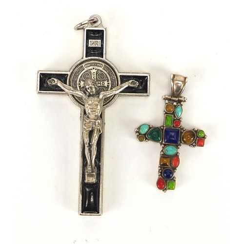 235 - Silver cross pendant set with semi precious stones and a white metal and black enamel crucifix penda... 