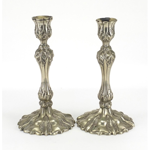 138 - Pair of silver plated candlesticks, 25cm high