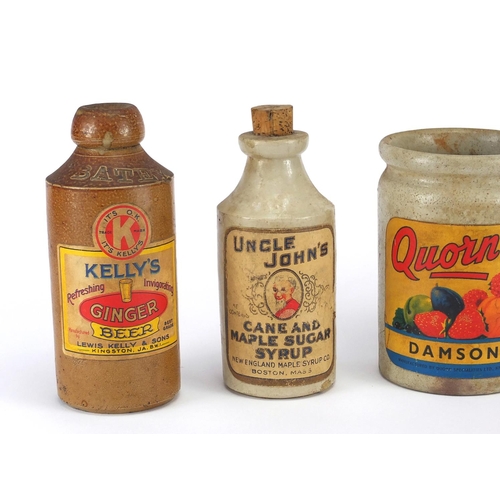 159 - Five stoneware advertising bottles with paper labels, including Damson Jam, Uncle John's Cane and Ma... 