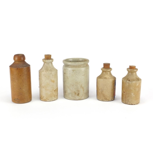 159 - Five stoneware advertising bottles with paper labels, including Damson Jam, Uncle John's Cane and Ma... 