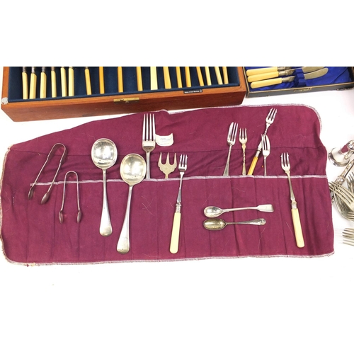 200 - Silver plated and stainless steel cutlery, some with ivorine handles and two silver spoons