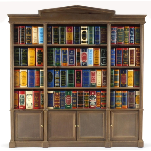 2123 - Collection of Del Prado miniature books housed in a bookcase of small proportions, the books includi... 