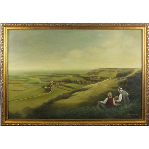 121 - L.B. Sheann 1991 - Oil on board, figures overlooking the downs, gilt framed, 75cm x 50cm