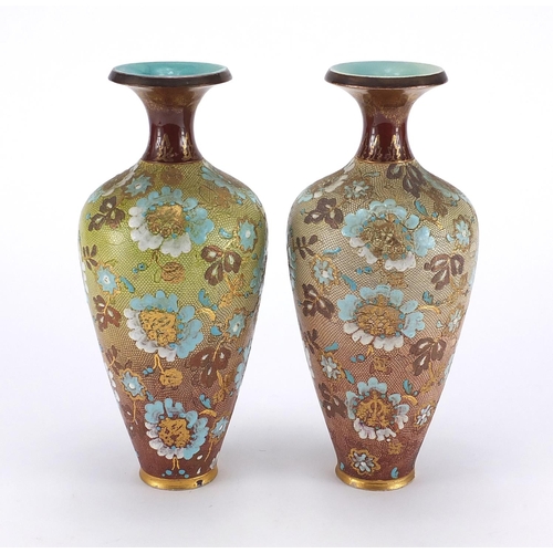 134 - Two Doulton Slater's stoneware vases, 24cm high