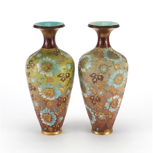 134 - Two Doulton Slater's stoneware vases, 24cm high