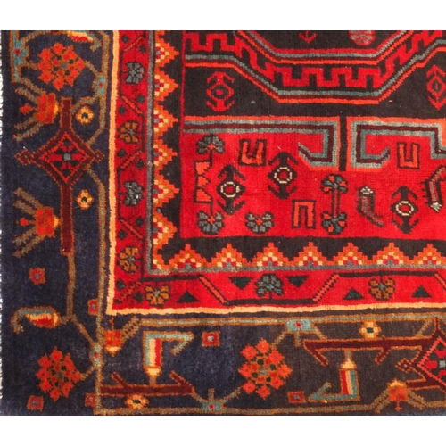 2054 - Rectangular Persian Kshan rug, having an all over floral and geometric design on to red dark ground,... 