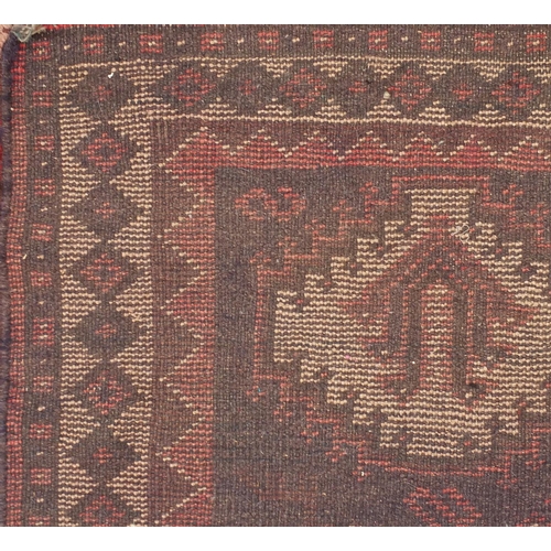 2080 - Rectangular persian rug having all over floral motifs onto a reg ground, approximately 225cm x 155cm