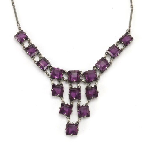 241 - Art Deco Platinon necklace set with purple glass stones, 36cm in length