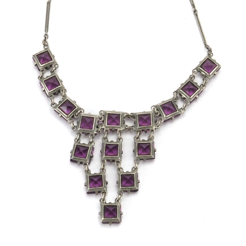 241 - Art Deco Platinon necklace set with purple glass stones, 36cm in length