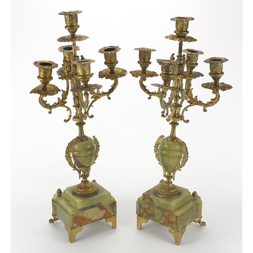 157 - Pair of onyx and gilt brass four branch candelabra, each 48cm high