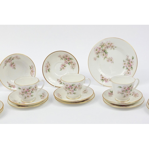 141 - Coalport dinner and teaware, including cups, saucers and dinner plates with floral decoration, each ... 