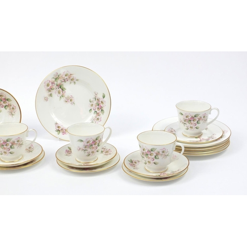 141 - Coalport dinner and teaware, including cups, saucers and dinner plates with floral decoration, each ... 