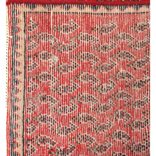 98 - Rectangular Persian hamadam carpet runner, having all over stylised design onto a red ground, 267cm ... 