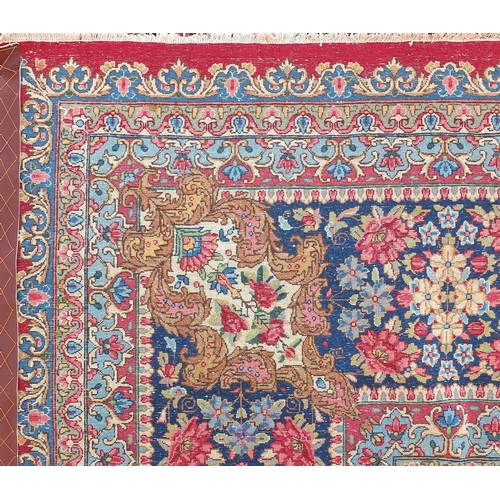 2014 - Large rectangular Kerman rug having an all over floral motifs, with corresponding boarders onto a re... 