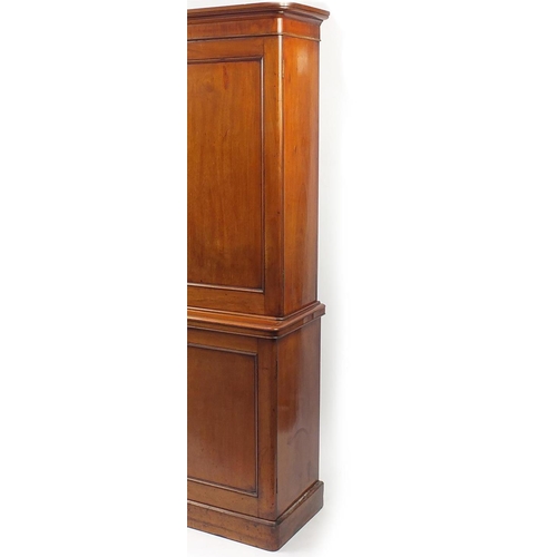 2023 - Victorian mahogany enclosed book case, fitted with a pair of doors enclosing three adjustable shelve... 