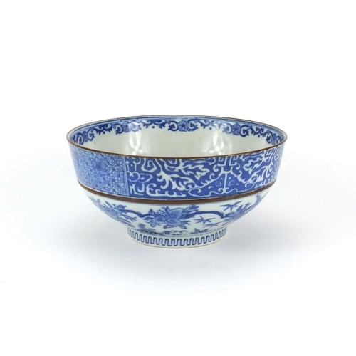 140 - Japanese blue and white porcelain bowl decorated with flowering branches, 18cm in diameter