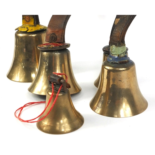 168 - Five bronzed metal church hand bells, with leather straps