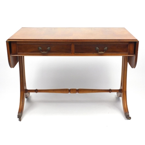 44 - Line inlaid yew wood sofa table fitted with two frieze drawers, 73cm H x 104cm W x 56cm D