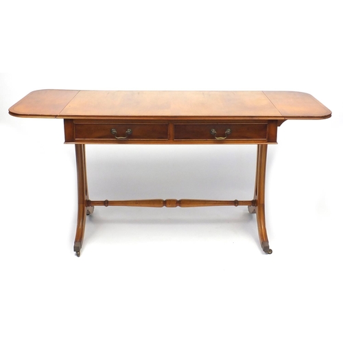 44 - Line inlaid yew wood sofa table fitted with two frieze drawers, 73cm H x 104cm W x 56cm D
