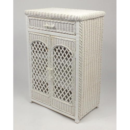 81 - Cane and wicker two door bathroom cabinet, fitted with a frieze drawer, 87cm H x 58cm W x 37cm D