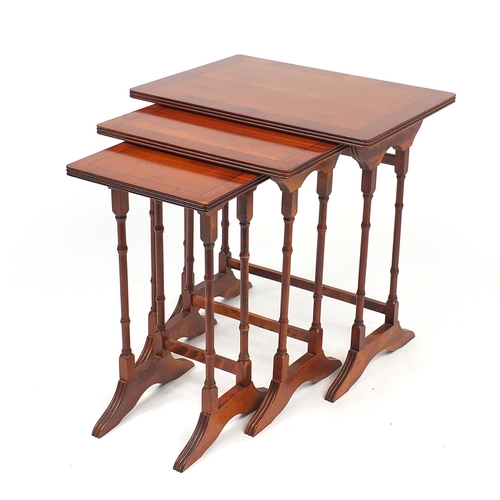 87 - Nest of three line inlaid yew occasional tables, the larger 55cm H x 53cm W x 39cm D