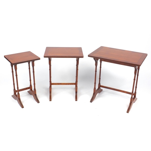 87 - Nest of three line inlaid yew occasional tables, the larger 55cm H x 53cm W x 39cm D