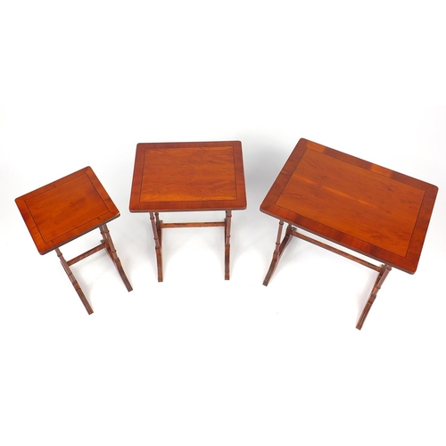 87 - Nest of three line inlaid yew occasional tables, the larger 55cm H x 53cm W x 39cm D