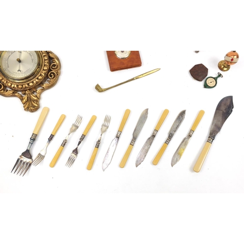 184 - Box of objects including a Bakelite map measurer, fish knives and forks, gilt barometer, silver plat... 