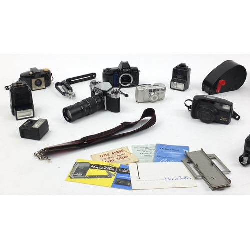 198 - Vintage and later cameras, lenses and accessories including Nikon, Canon and Praktica examples