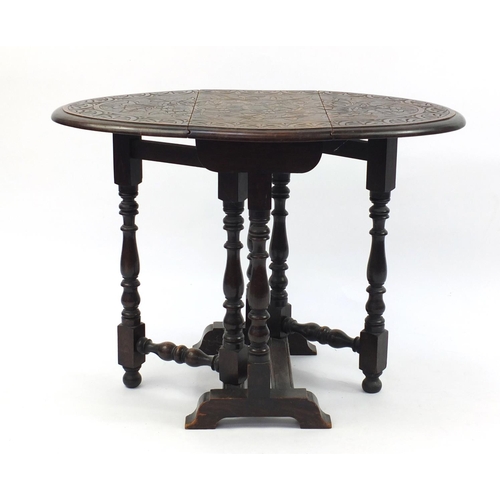 8 - Carved oak gate leg table, 63cm high