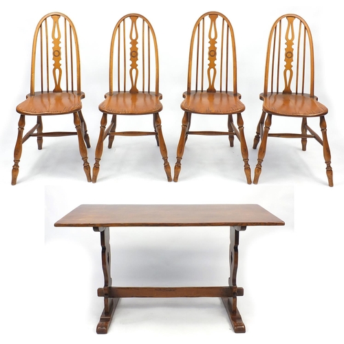 52 - Rectangular oak dining table with a set of four stick back chairs, the table 75cm H x 138cm W x 72cm... 
