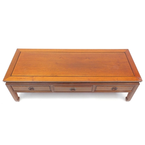 56 - Oriental hard wood coffee table fitted with three drawers, 41cm H x 137cm W x 51cm D