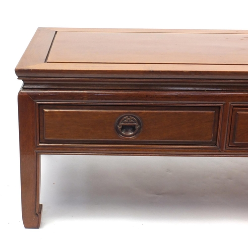 56 - Oriental hard wood coffee table fitted with three drawers, 41cm H x 137cm W x 51cm D